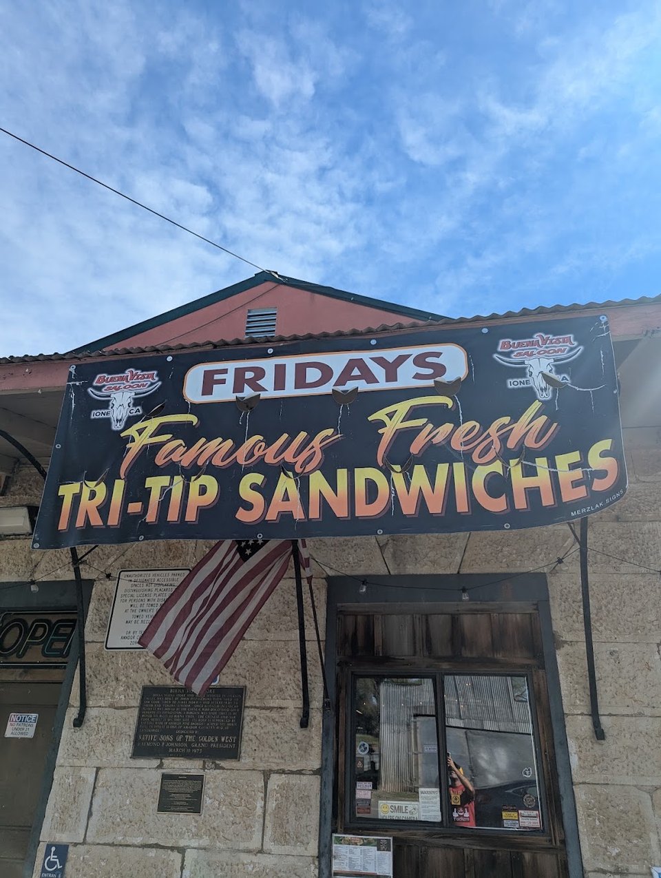 Printed menu showing breakfast and sandwiches.