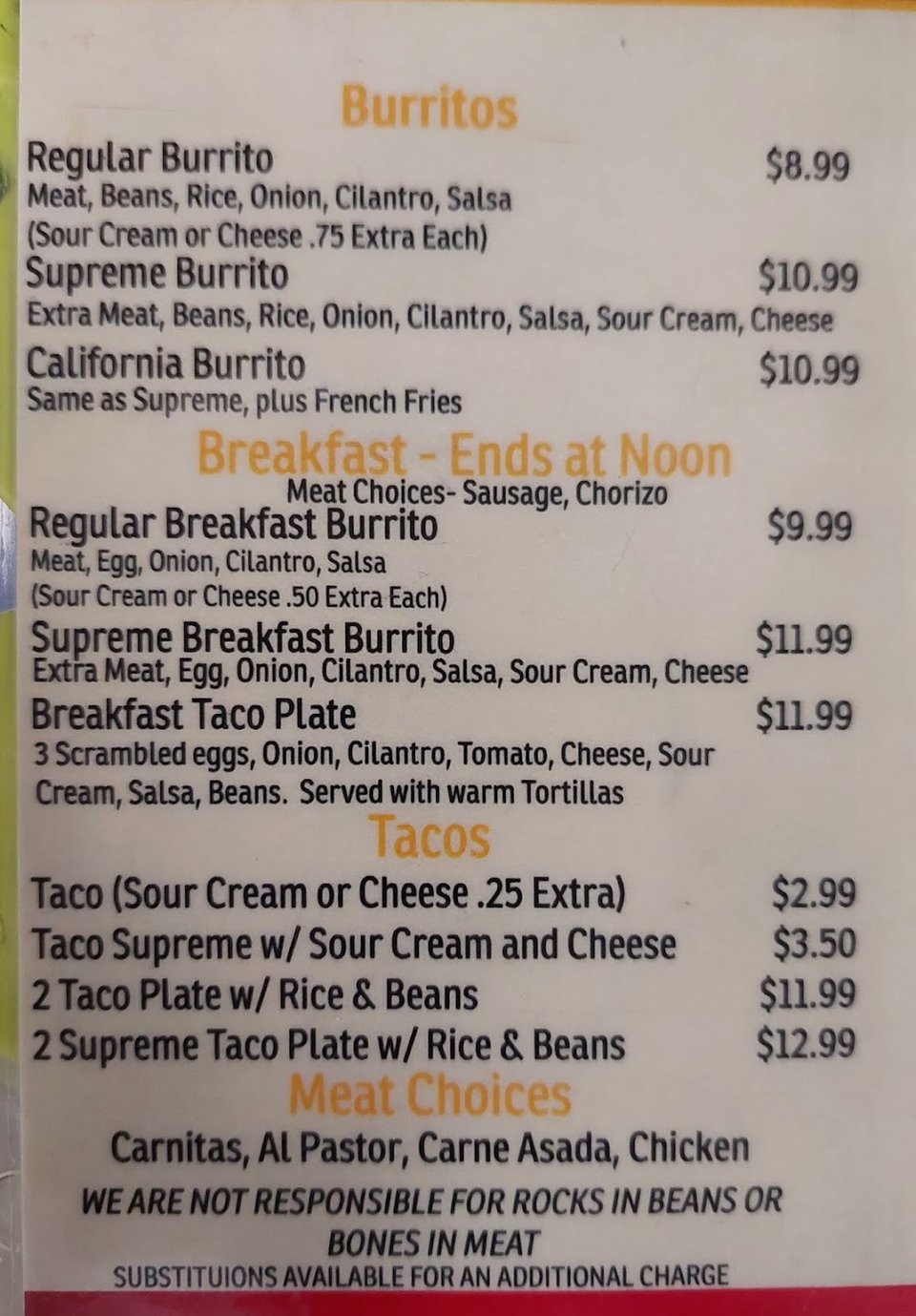 Food menu laid out on a counter.